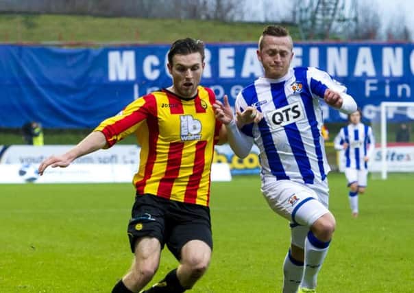 Partick's Stephen O'Donnell (left) and Sammy Clingan battle for possession. Picture: SNS