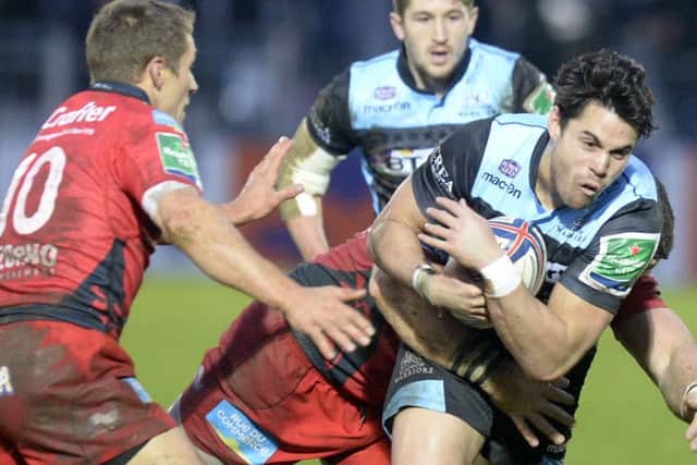 Sean Maitland (right) is challenged by Toulon's Jonny Wilkinson. Picture: SNS