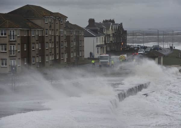 Flooding and ice warnings have been issued across eastern parts of Scotland. Overflowing tidal waves are seen in Troon from earlier thsi month. Picture: Robert Perry