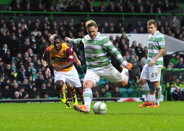 Kris Commons scores his second goal as Celtic eased to victory over Motherwell. Picture: Robert Perry