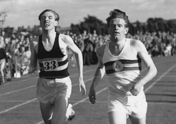 Chris Chataway, right, winning the 3,000m at Wealdstone in 1956. Picture: Getty