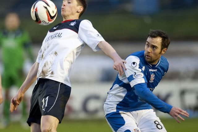 Falkirks Conor McGrandles tries to chest the ball down as Jamie Stevenson looks on. Picture: SNS