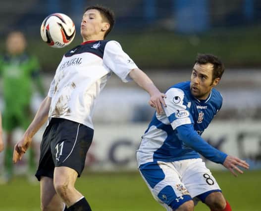 Falkirks Conor McGrandles tries to chest the ball down as Jamie Stevenson looks on. Picture: SNS