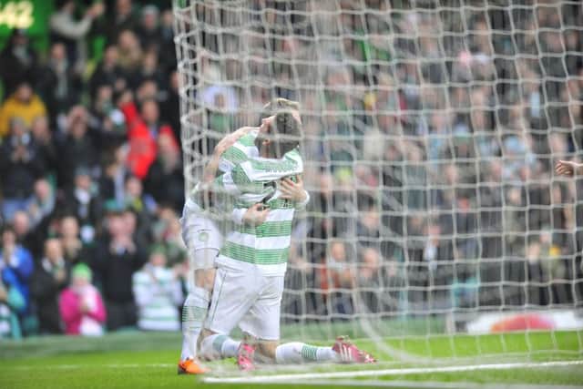 Kris Commons celebrates his first goal with Charlie Mulgrew. Picture: Robert Perry