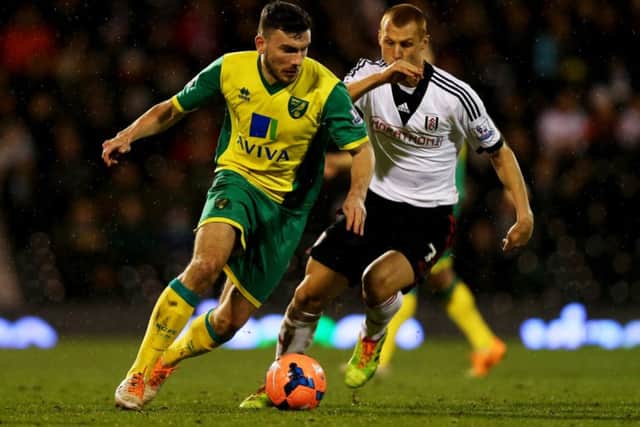 Robert Snodgrass is chased by Steve Sidwell in an FA Cup tie between Norwich City and Fulham. Picture: Getty