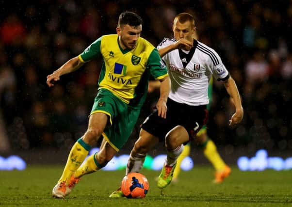 Robert Snodgrass is chased by Steve Sidwell in an FA Cup tie between Norwich City and Fulham. Picture: Getty