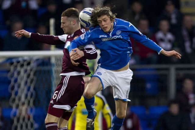 St Johnstone's Murray Davidson (right) and Brad McKay jump for a header. Picture: SNS