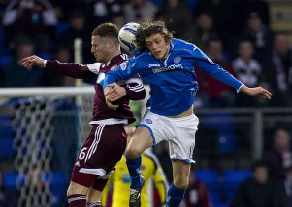 St Johnstone's Murray Davidson (right) and Brad McKay jump for a header. Picture: SNS