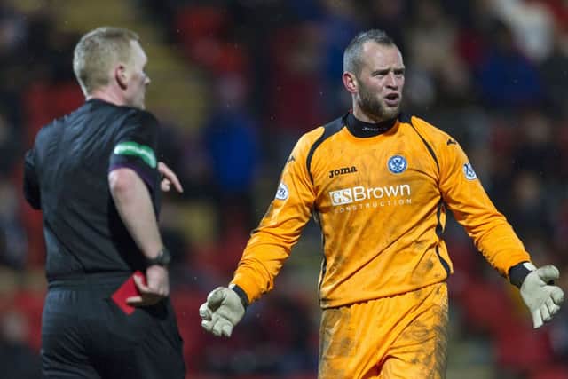 Alan Mannus is unimpressed with Brian Colvin's decision to show him a red card. Picture: SNS