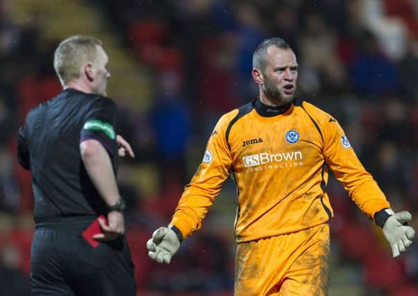 Alan Mannus is unimpressed with Brian Colvin's decision to show him a red card. Picture: SNS
