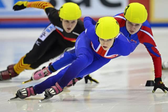 Elise Christie , centre, said she was devastated to hear of Wang Mengs ankle injury. Picture: Getty
