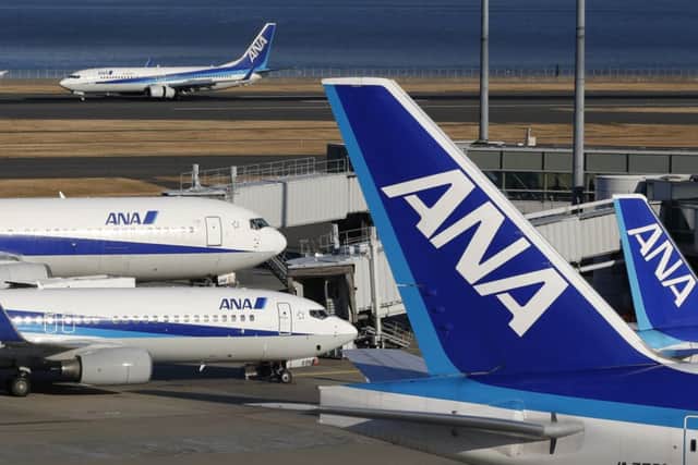 All Nippon Airways (ANA) passenger planes park at Haneda Airport in Tokyo. Picture: AP