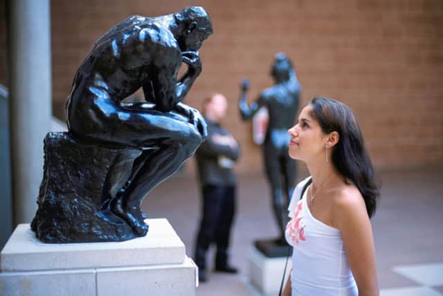 Woman looks at the sculpture The Thinker by Rodin on show at The Burrell collection. Picture: Contributed