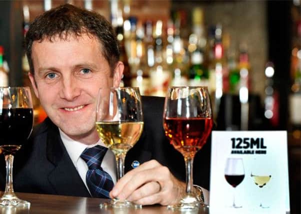 Michael Matheson has urged pubs and clubs to stock up on smaller glasses. Picture: Colin Hattersley