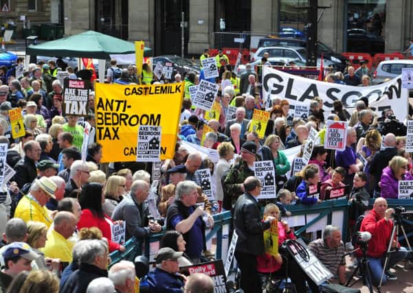 A bedroom tax demonstration in Glasgow last year. Over 15 million pounds has been claimed by Scottish families struggling to deal with the controversial welfare reform. Picture: TSPL