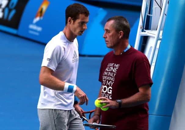 Andy Murray and coach Ivan Lendl plot their tactics against Roger Federer. Picture: AP