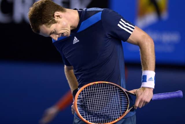 Andy Murray reacts after losing a point during his quarter final defeat to Roger Federer. Picture: AP