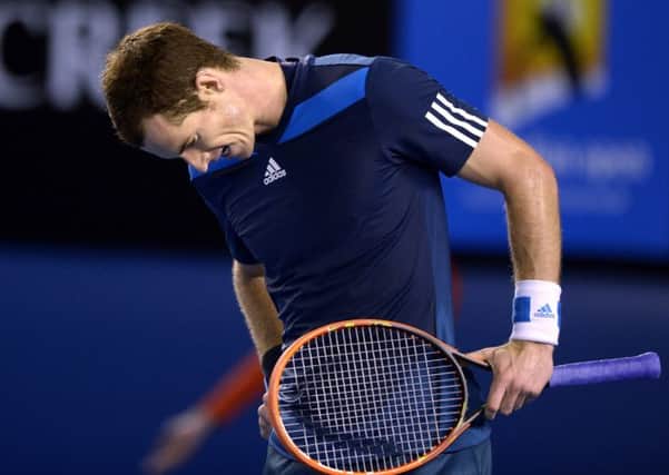 Andy Murray reacts after losing a point during his quarter final defeat to Roger Federer. Picture: AP
