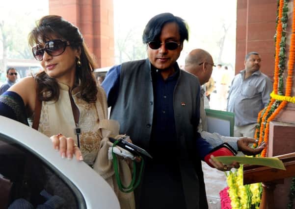Shashi Tharoor and his wife Sunanda Pushkar arrive at the parliament in 2012. Picture: AFP/Getty