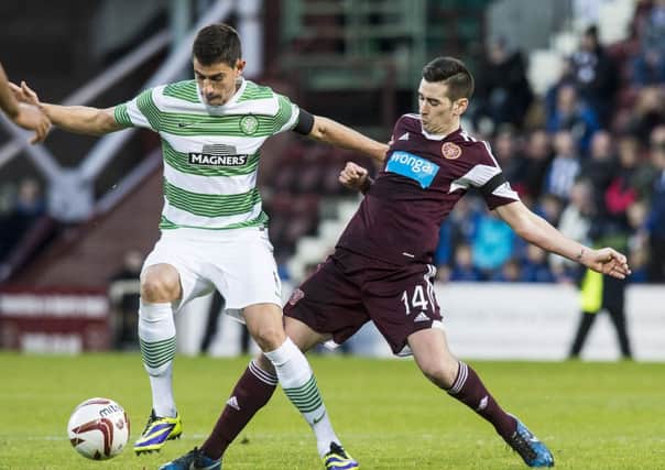 Nir Biton holds off Jamie Walker of Hearts. Picture: Ian Georgeson
