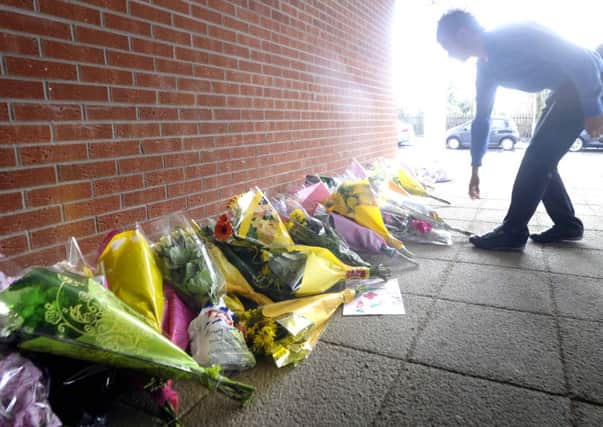 Flowers left outside Lanark Grammar School in memory of Natasha Paton in 2010. Picture: Jane Barlow