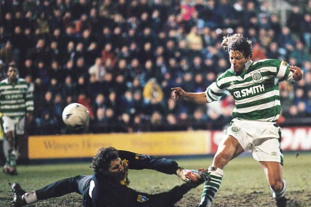 Jorge Cadete of Celtic lifts the ball over the head of Hearts goalkeeper Gilles Rousset. Picture: TSPL