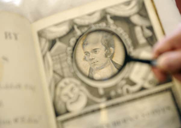 National Library of Scotland Curator Robert Betteridge inspects the Robert Burns manuscripts. Picture: Greg Macvean