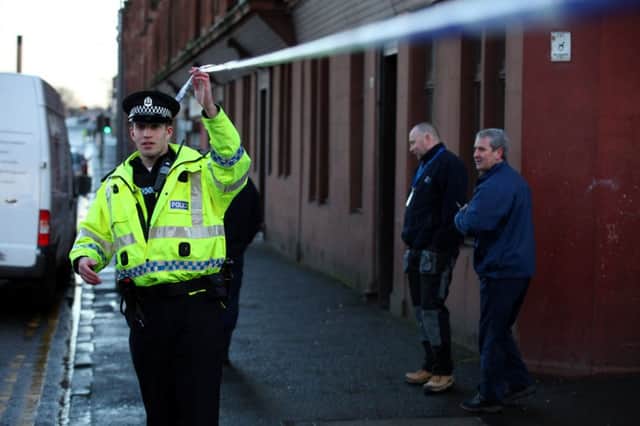 Police at the scene of a shooting in Westmuir Street in Glasgows East End. Picture: HeMedia