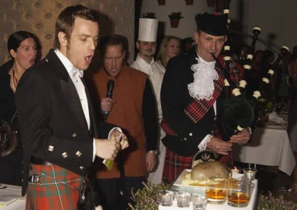 Actor Ewan McGregor addresses the haggis at a Burns Night in 2002. Picture: Getty