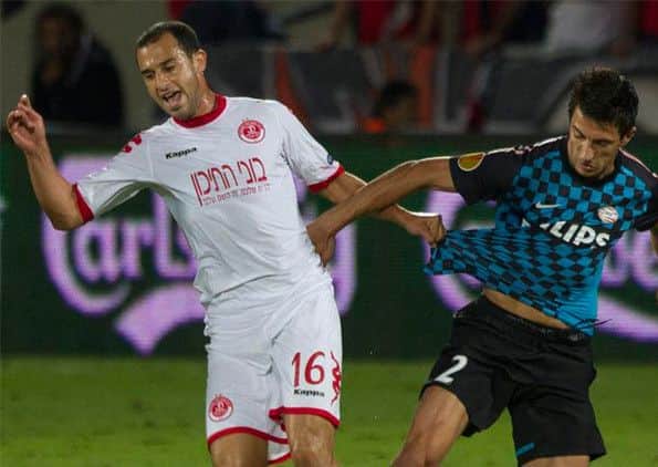 Omer Damari, left, tussles with Stanislav Manolev of PSV Eindhoven. Picture: AP
