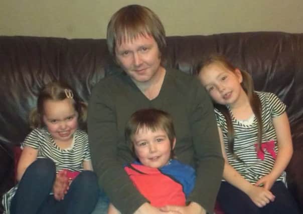 Adam Byrne, Gaelic writer and dialect specialist with his three children, from left, Saorsa, 4, Lachann, 4, and Caoimhe, 6. Picture: contributed