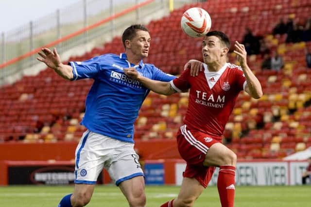 Aberdeens Ryan Jack, right, and Gary McDonald of St Johnstone in league action this season. Picture: SNS