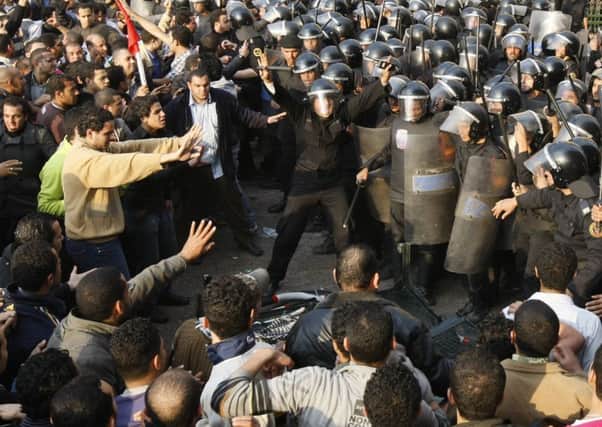 Egyptian demonstrators clash with police in central Cairo on this day in 2011. Picture: Getty