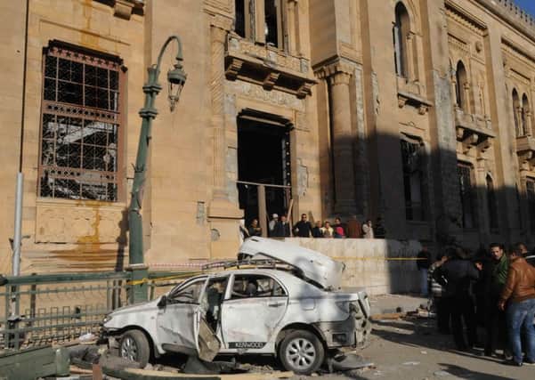 The wreckage of a car outside the Museum of Islamic Art following a bomb explosion in Cairo. Picture: Getty