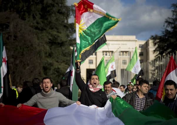 Syrian opposition demonstrators outside the United Nations headquarters in Geneva. Picture: AP