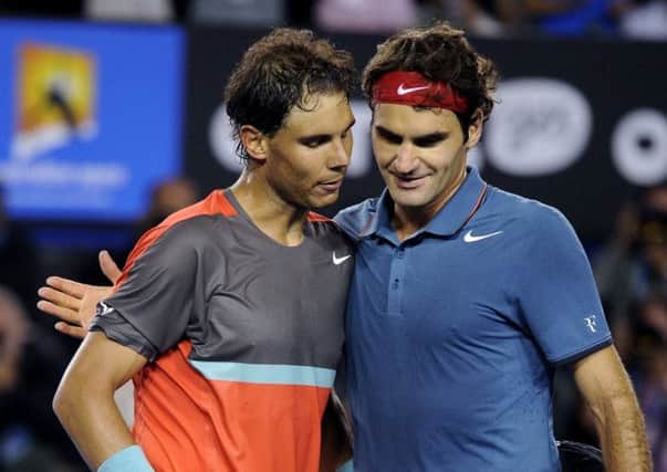 Rafael Nadal embraces Roger Federer after their semifinal. Picture: AP