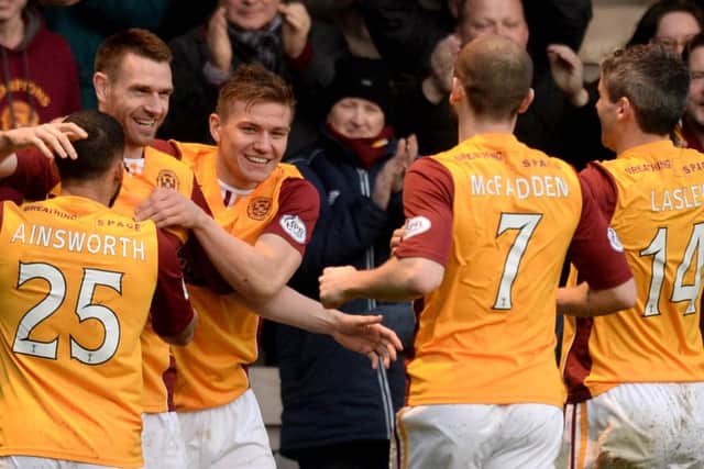 Stephen McManus celebrates after putting his side ahead. Picture: SNS