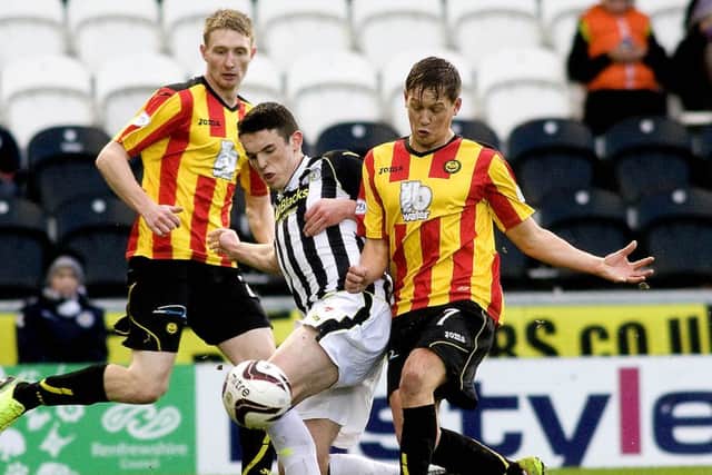 St Mirren's John McGinn (left) challenges James Craigen. Picture: SNS