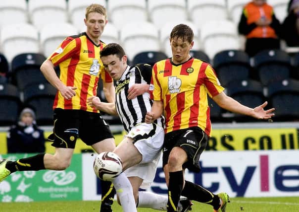St Mirren's John McGinn (left) challenges James Craigen. Picture: SNS