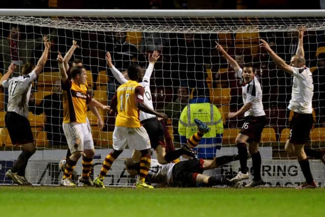 Russell Anderson (#4) levels the score late on. Picture: SNS