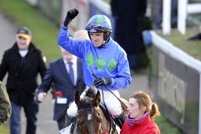 Ruby Walsh celebrates victory in the Irish Champion Hurdle aboard Hurricane Fly yesterday. Picture: Getty