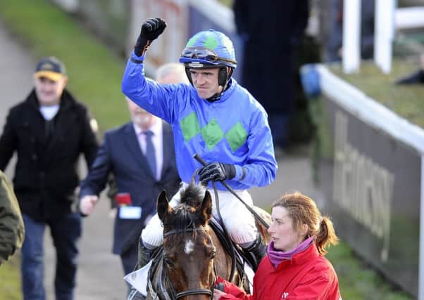 Ruby Walsh celebrates victory in the Irish Champion Hurdle aboard Hurricane Fly yesterday. Picture: Getty