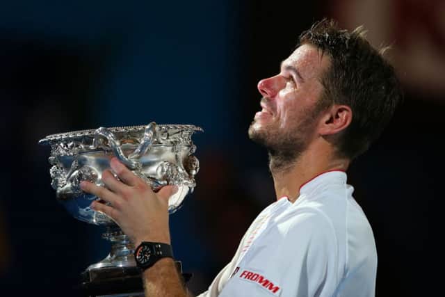 Stanislas Wawrinka lifts the Norman Brookes Challenge Trophy. Picture: Getty