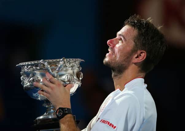 Stanislas Wawrinka lifts the Norman Brookes Challenge Trophy. Picture: Getty