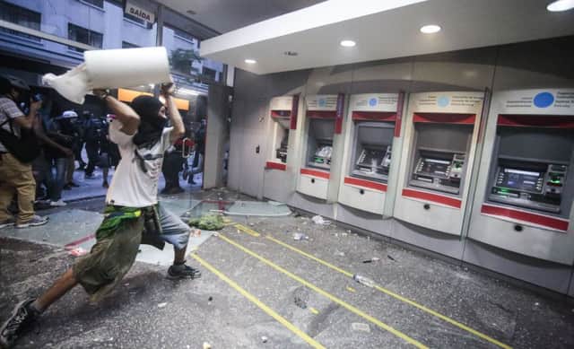 Banks were targeted in Sao Paulo in protests against the mounting cost of the World Cup. Picture: AFP