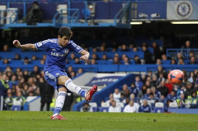 Brazilian midfielder Oscar unleashes the stunning free kick which provided the only goal. Picture: AP