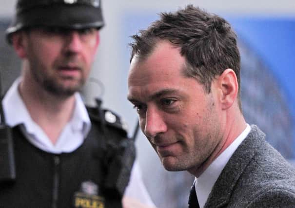 Jude Law arrives at the Old Bailey yesterday to give evidence in the hacking trial. Picture: Getty