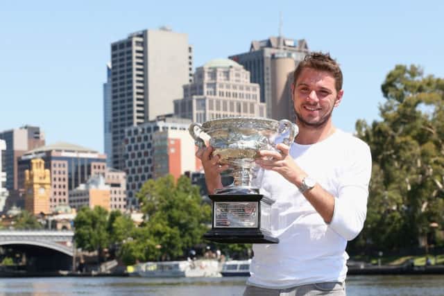 Australian Open winner Stanislas Wawrinka poses with the Norman Brookes Challenge Cup in Melbourne. Picture: Getty