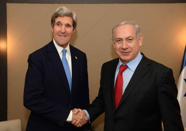 Benjamin Netanyahu, right, is all smiles in Davos with US ally John Kerry. Picture: Getty