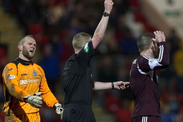 Referee Brian Colvin showsSt Johnstone keeper Alan Mannus the red card. Picture: SNS